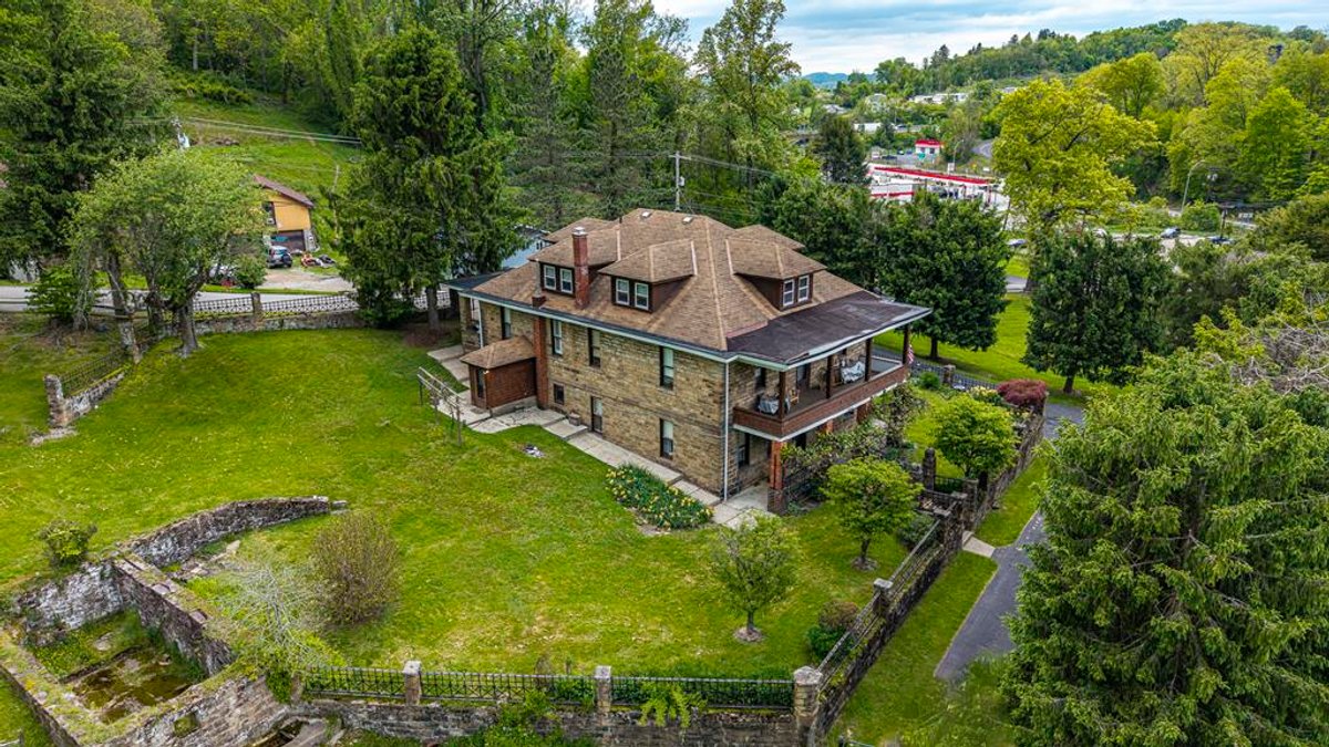 Image for SOLD $1,265,000 - Prime Fairmont Development Opportunity: Homes & Building on 38 ½ Acres with Mineral Interests