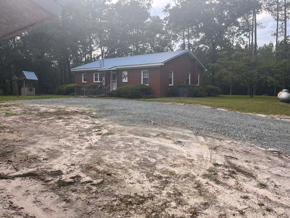 Image for 43 acres in Harnett County with a brick home in an onsite live /online / simulcast auction event!