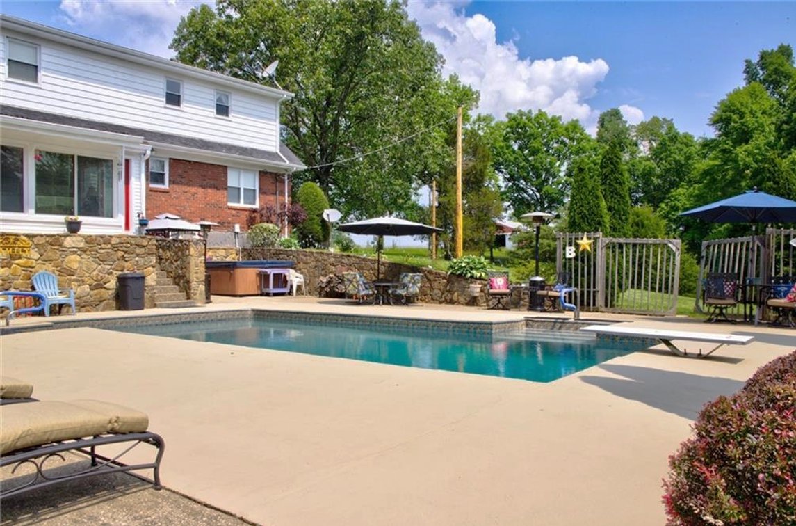 Image for Harrison County Real Estate Auction,  Cape Cod on 9.87 Acres, Inground Pool, Koi Pond & Finished Walkout - ONLINE AUCTION ONLY