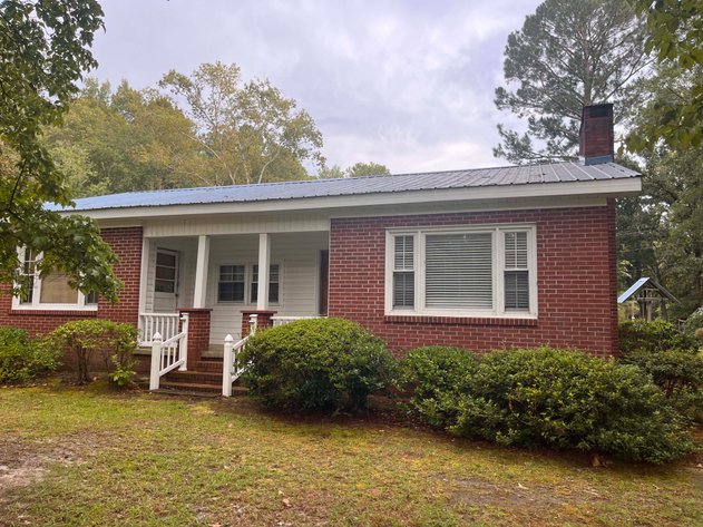 Image for 43 acres in Harnett County with a brick home in an onsite live /online / simulcast auction event!