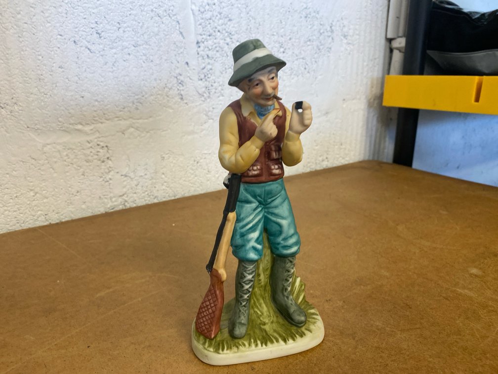 Porcelain Elderly Hunter Figurine