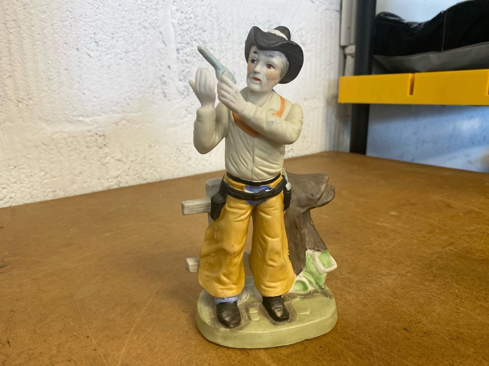 Porcelain Elderly Cowboy Figurine