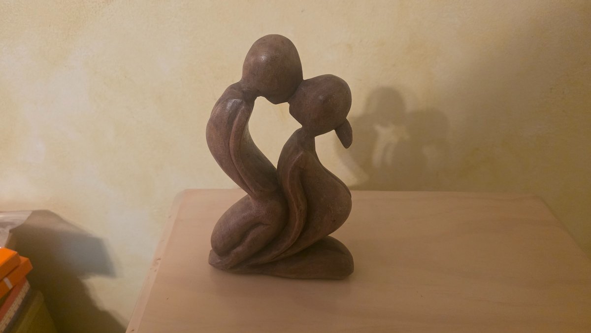 Carved Kissing Couple Statue