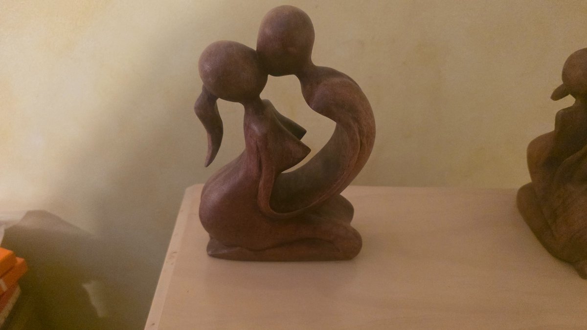 Carved Kissing Couple Statue