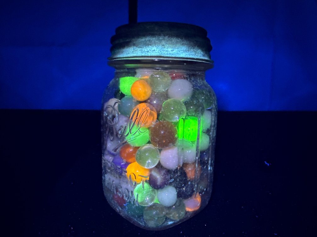 Jar of UV Reactive Un-Searched Marbles