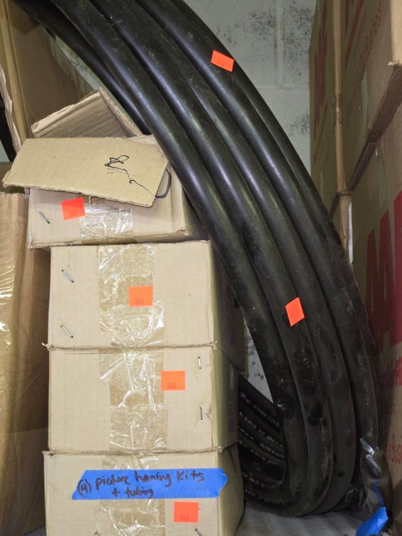(4) Xacto Levels, Roll of Water Tubing- On Pallet Racking Near Scrap Wood