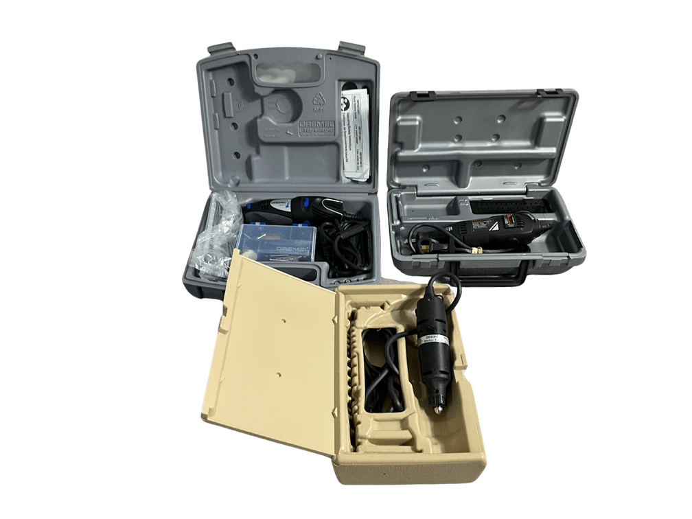 Three Dremel Tools in Cases 