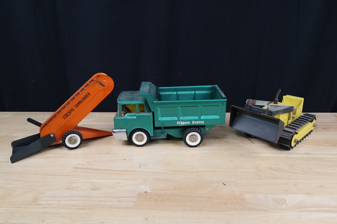(3) Vintage Strutco Toys, including Bulldozer, Dump Truck, and Sand Loader