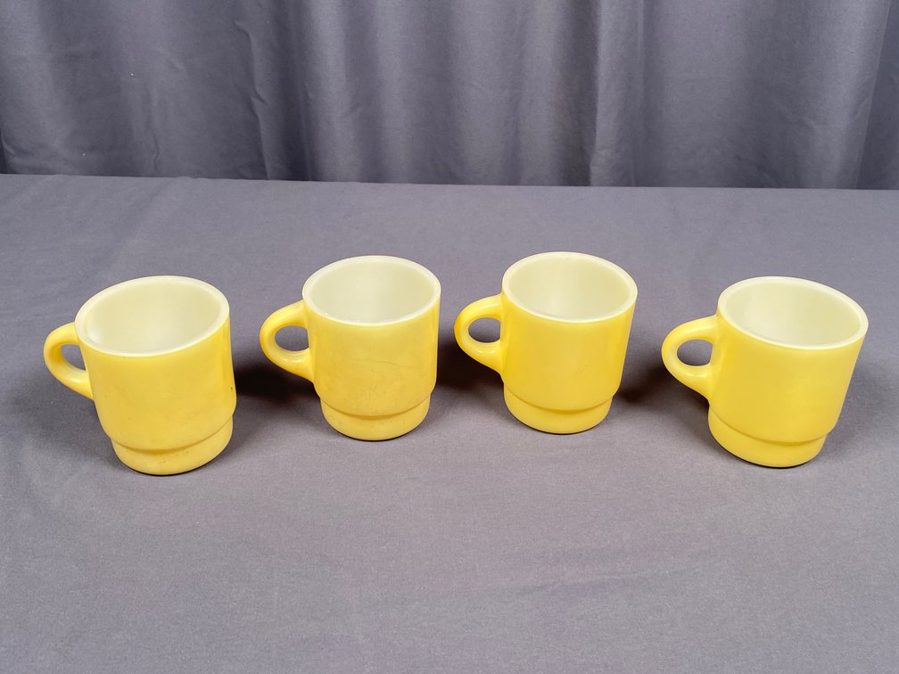 Collection of (4) Yellow Fire King Stackable Coffee Mugs