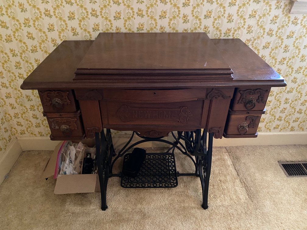 "New Home" Antique Sewing Machine Cabinet and Sewing Accessories