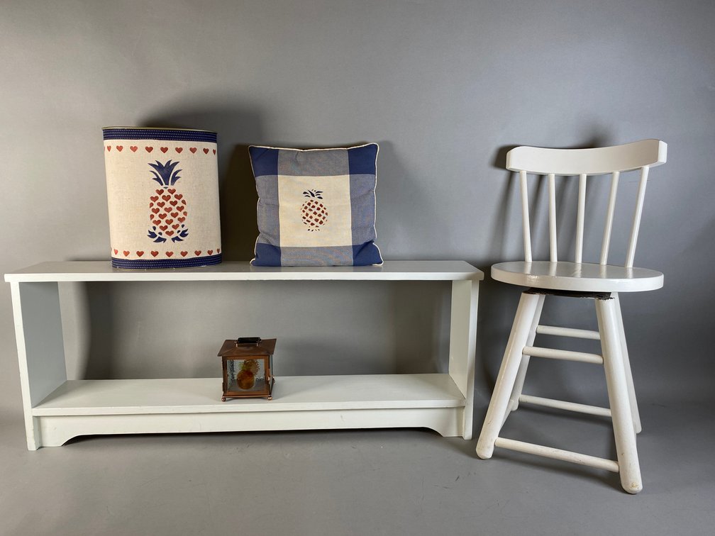 White Painted Wooden Shelf With Chair & Pineapple-Themed Decor
