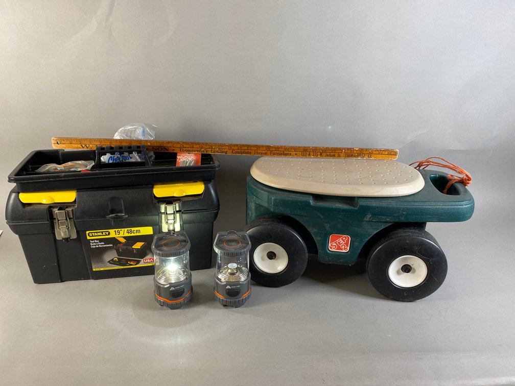 Stanley Toolbox With Various Tools, Step 2 Children's Rolling Stool, Vintage Wooden Feinberg'S Thomasville Yardstick, And (2) Ozark Trail Camping Lights
