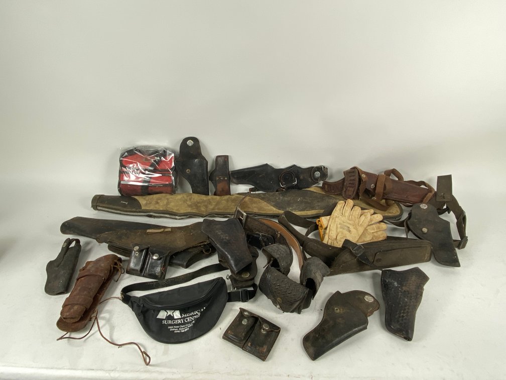 Assortment of worn Leather & Nylon Holsters and other firearm and Leather Accessories