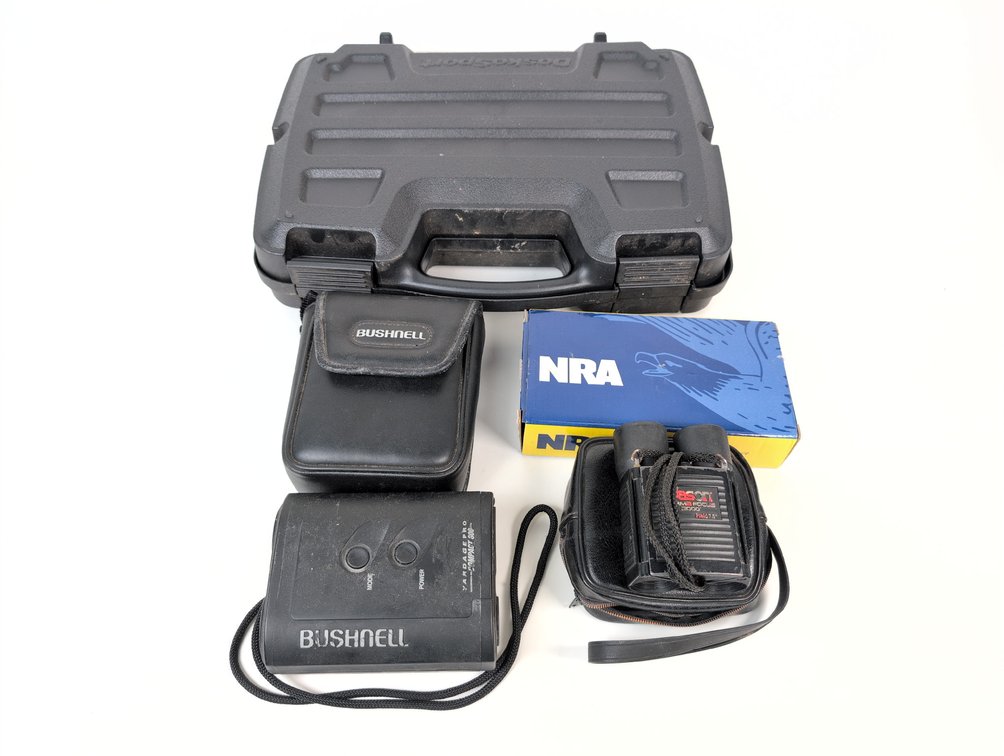 (1) Bushnell Yardage Pro Compact 300 Spotting Scope, (1) Jason Perma Focus 2000 Binoculars, (1)NRA Power Bank, (1) DoskoSport Padded Hard Shell Pistol Case