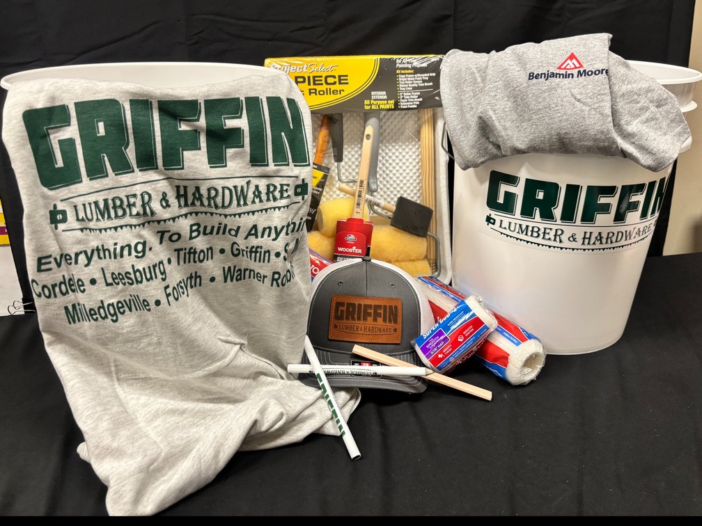 10 gallons of paint from Griffin Lumber with 2 buckets, t-shirts, hat, brushes, rollers, and pan