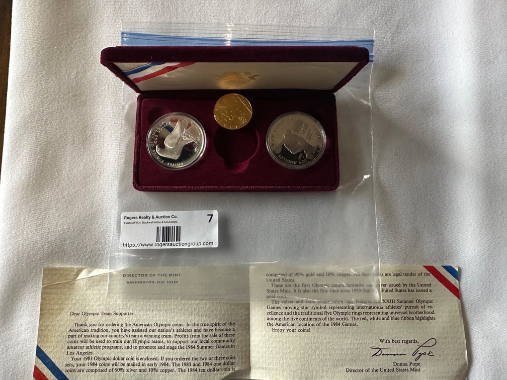 1983 S and 1984 S Silver Dollars 26.73 Grams per coin. 90% Silver and a 1984 S Gold Ten Dollar Coin. 16.76 Grams. 90% Gold
