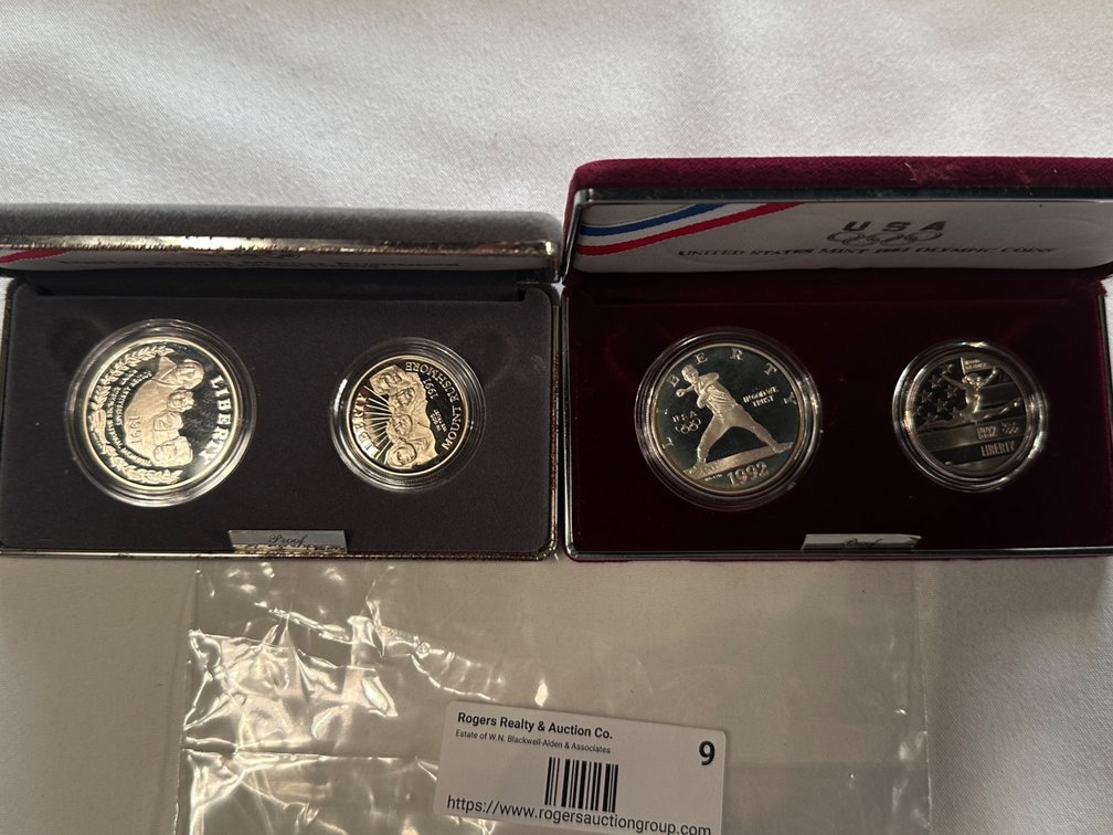2X Commemorative Sets. Each has a 90% Silver Dollar