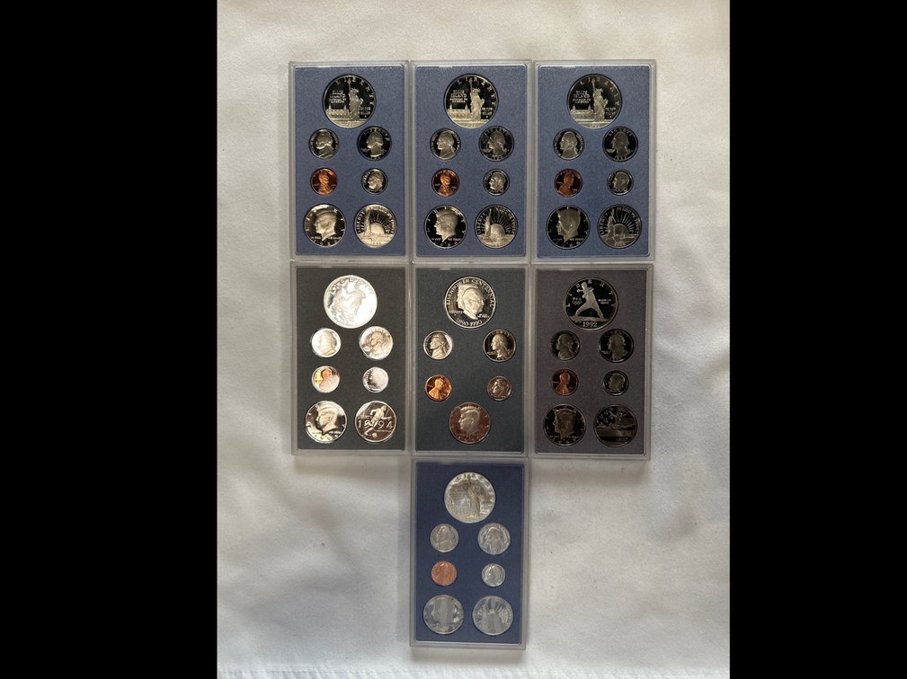 7X Prestige Proof Sets. Each has a 90% Silver Dollar