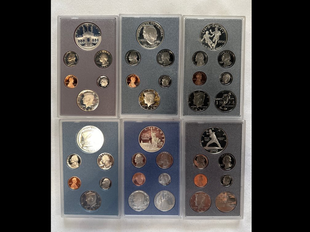 6X Different Prestige Proof Sets. Each set has a 90% Silver Dollar