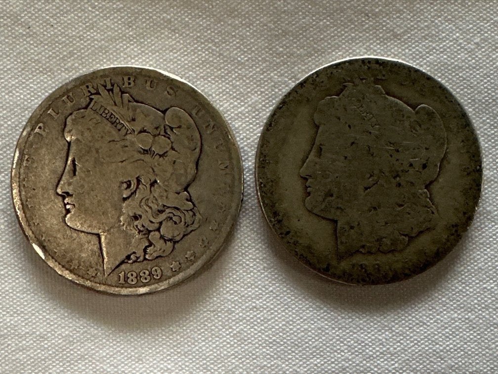 1889 and 1894? (date hard to see) Morgan Silver Dollars