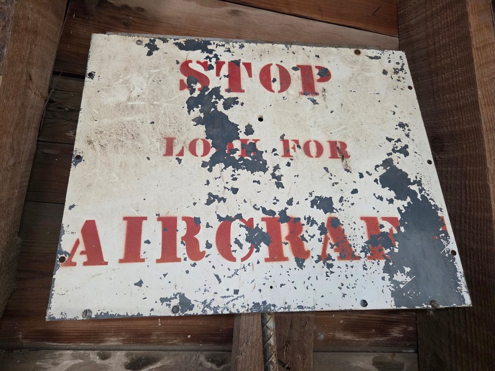 Metal sign "Stop, look for aircraft"