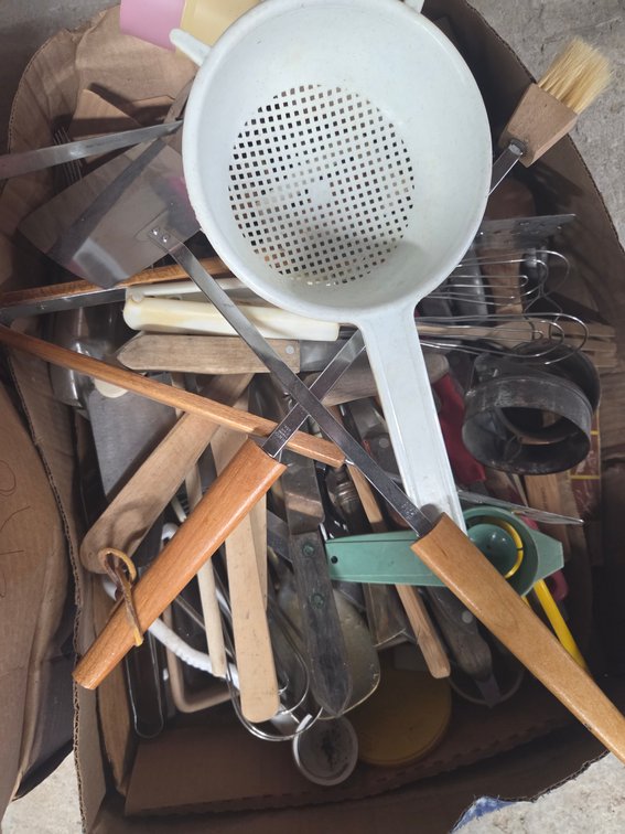 Assorted silverware, strainer, glasses and pans