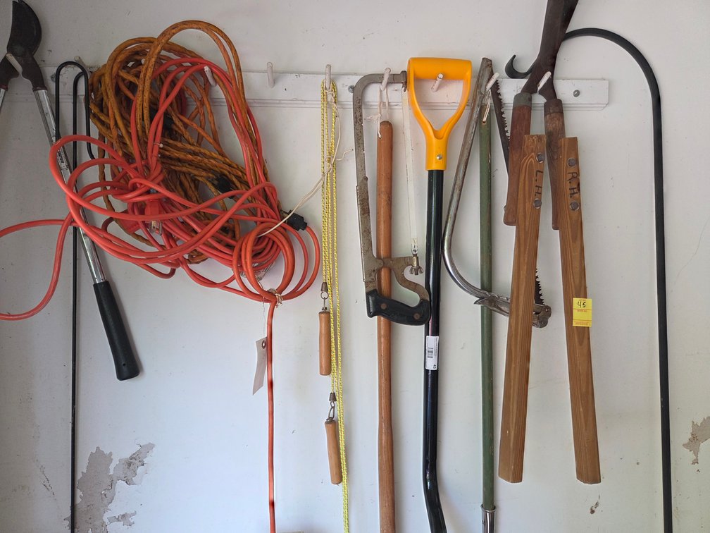 Assorted Garden Tools: Snow Shovel, Hack Saw, Hedge Trimmers, Extension Cords, Plastic Coca Cola Crate