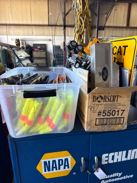 Various CAT toy trucks, signs and high vis jackets