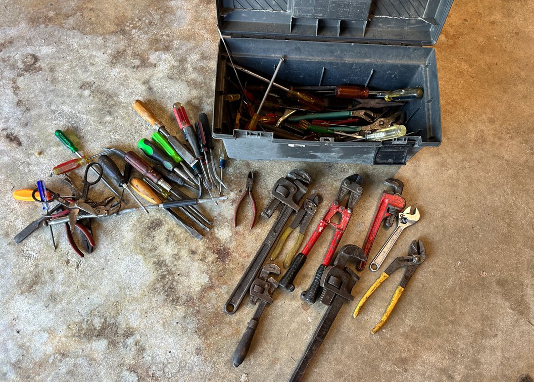 Toolbox of screwdrivers, Pipe wrench, bolt cutter, pliers, crescent wrench
