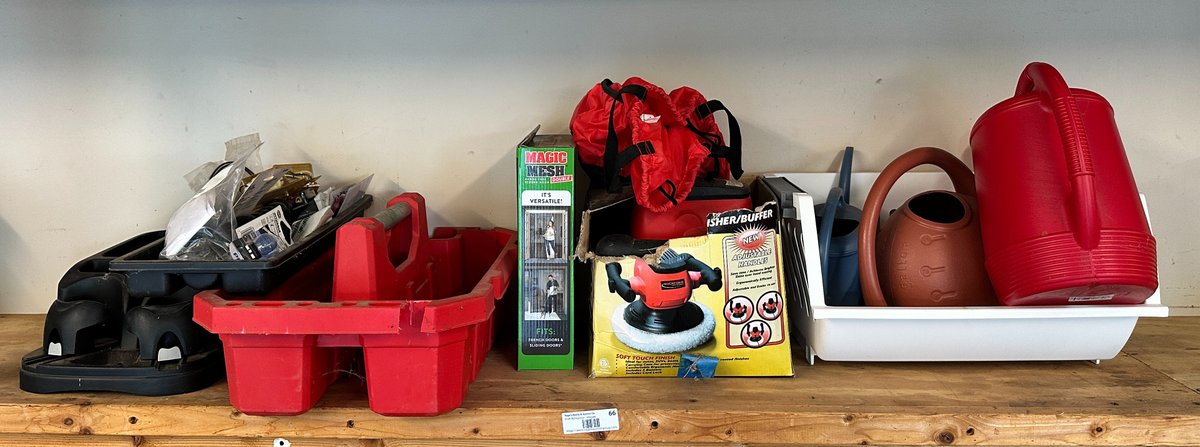 Contents of shelf- watering cans, car accessory, buffer