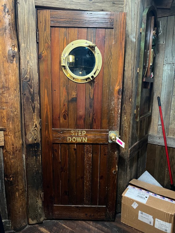 Wood ships door with porthole