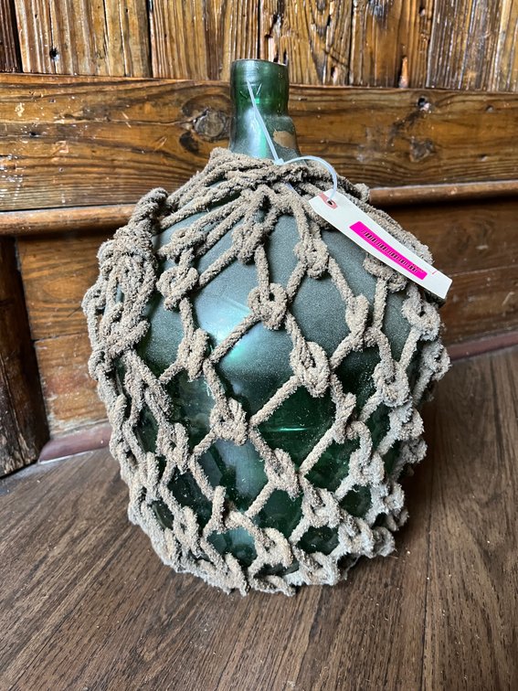Glass jug with rope netting