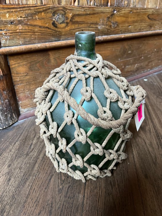 Glass jug with rope netting