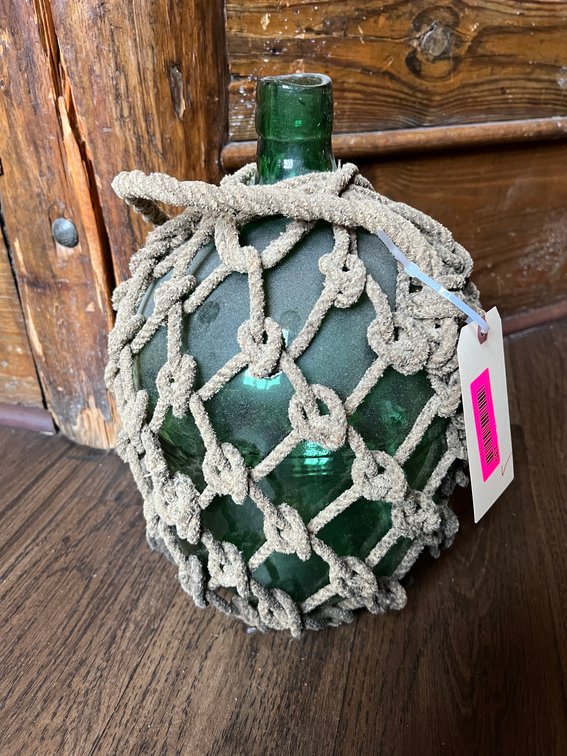 Glass jug with rope netting