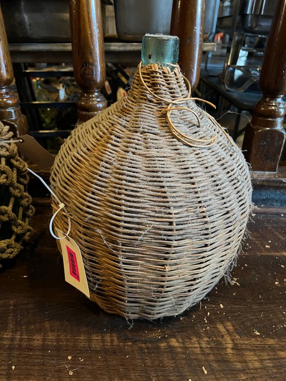 Glass jug with rattan cover