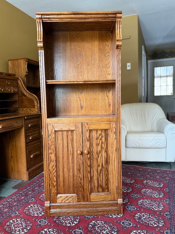 Oak bookcase with cabinet bottom