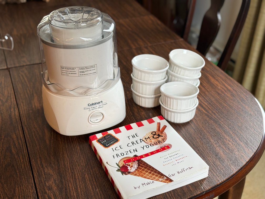 Ice cream maker with cookbook and dishes