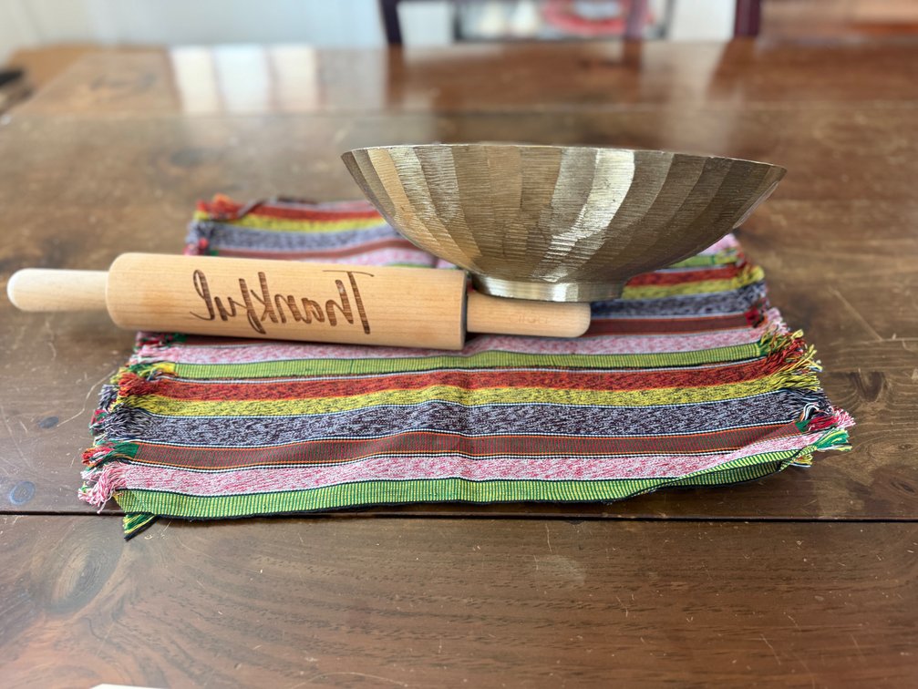 African placemats, metal bowl, rolling pin