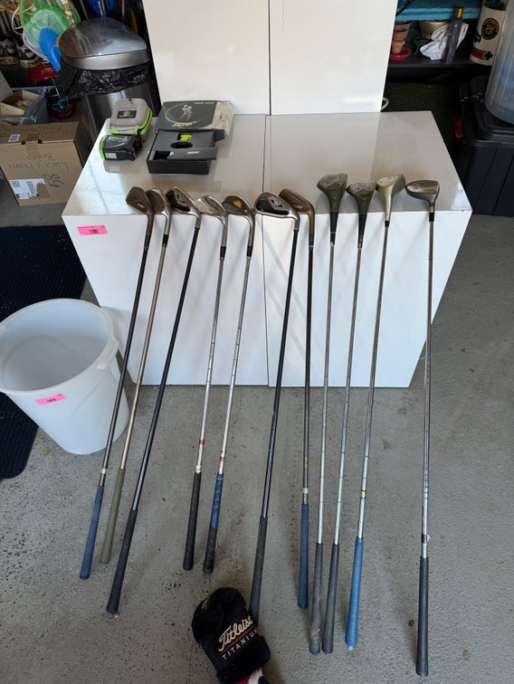Assorted golf clubs