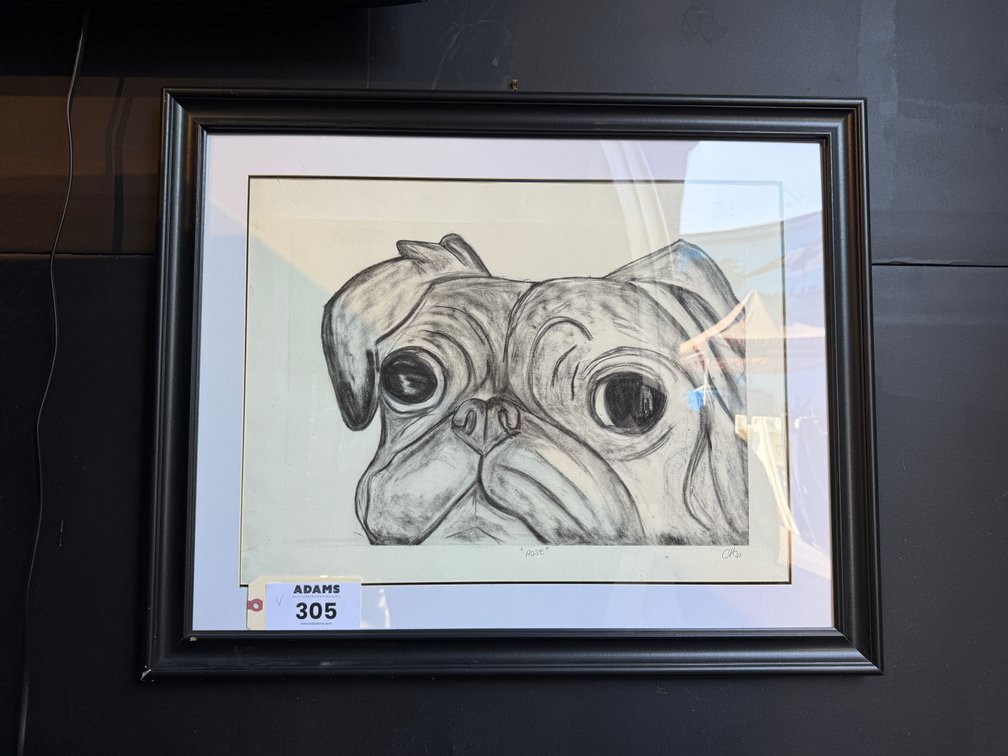 Framed charcoal dog drawing