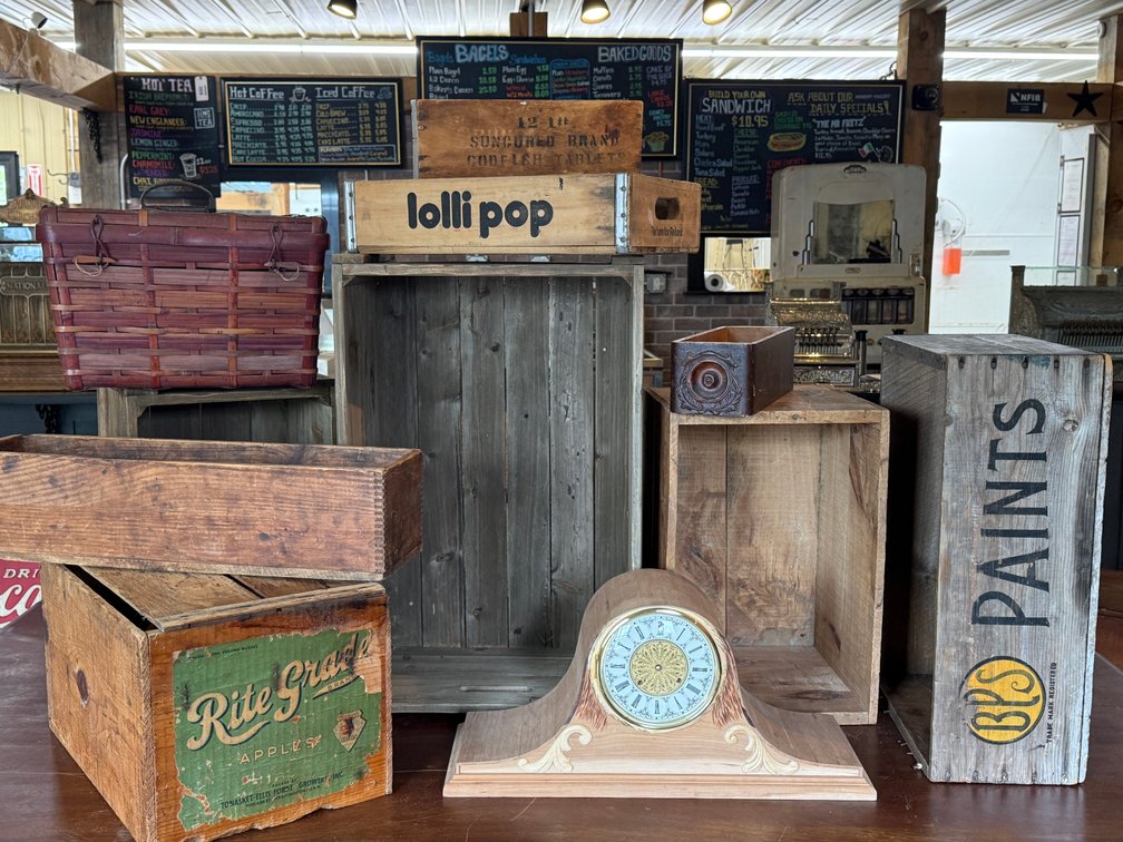 Basket, wooden crates, and mantel clock