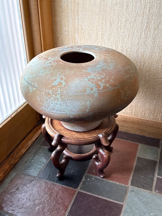 Mottled Earthenware Vessel on Wooden Stand