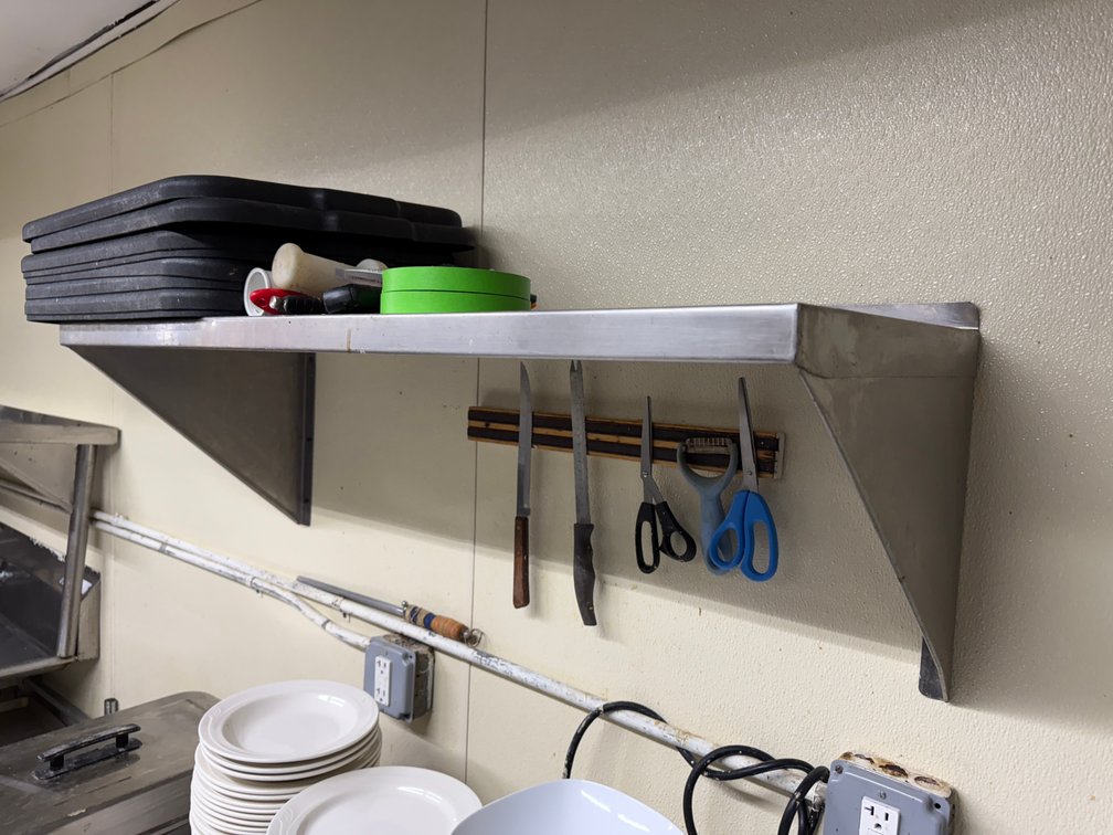 Stainless wall shelf
