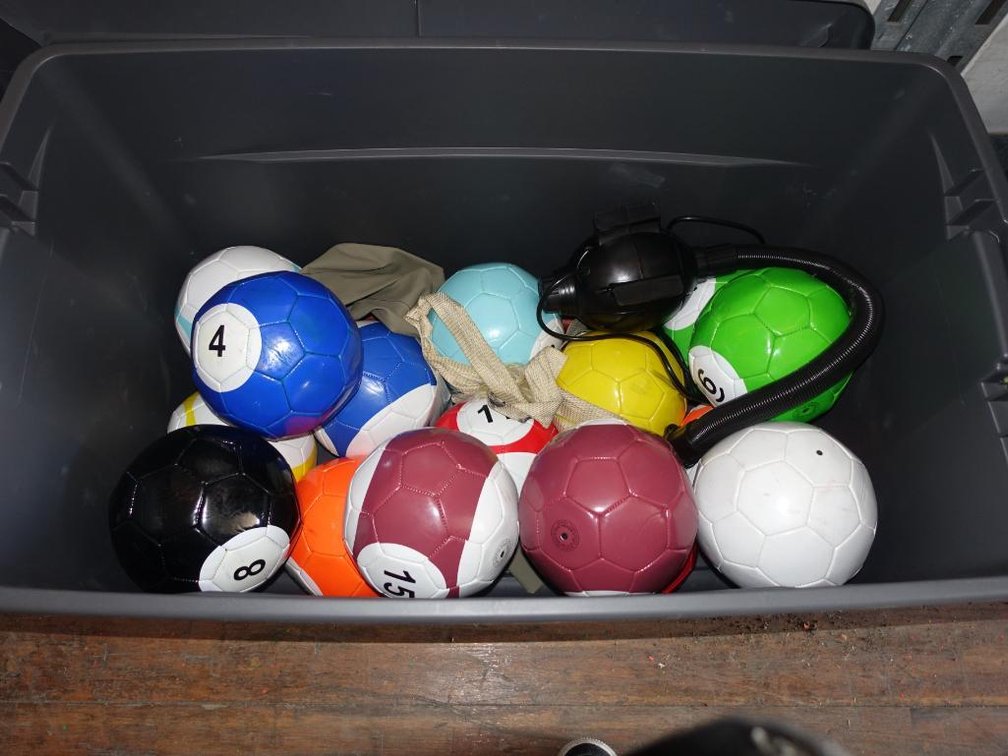 Bin with Assorted Inflatable Pool Table Accessories, 16 Soccer Balls, 2 Cue Sticks, Air Pump