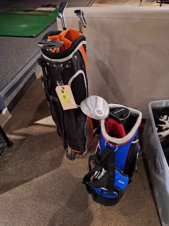 2 Assorted Junior Golf Club Bags and Clubs