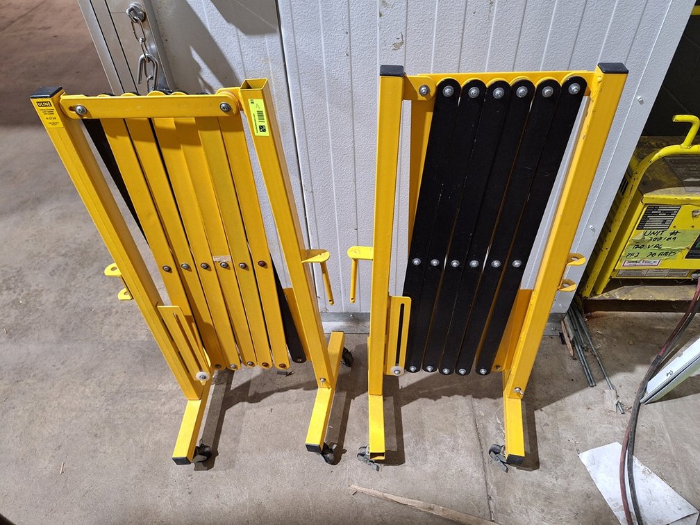 2 Uline Expanding Barriers on Wheels