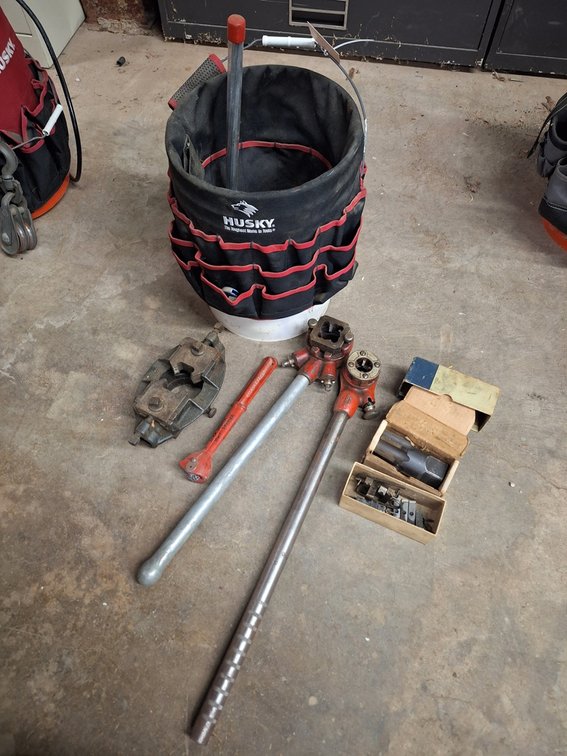 Assorted Pipe Threading Tools in Bucket