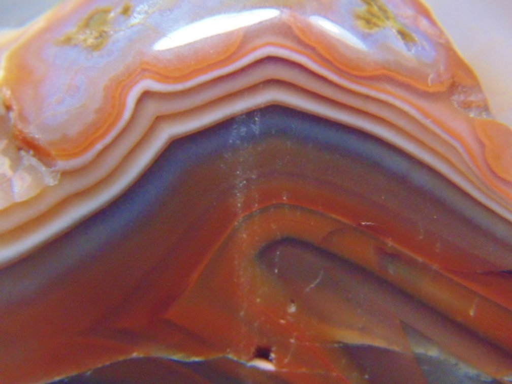 A 7.6  oz polished Lake Superior Agate with peeling