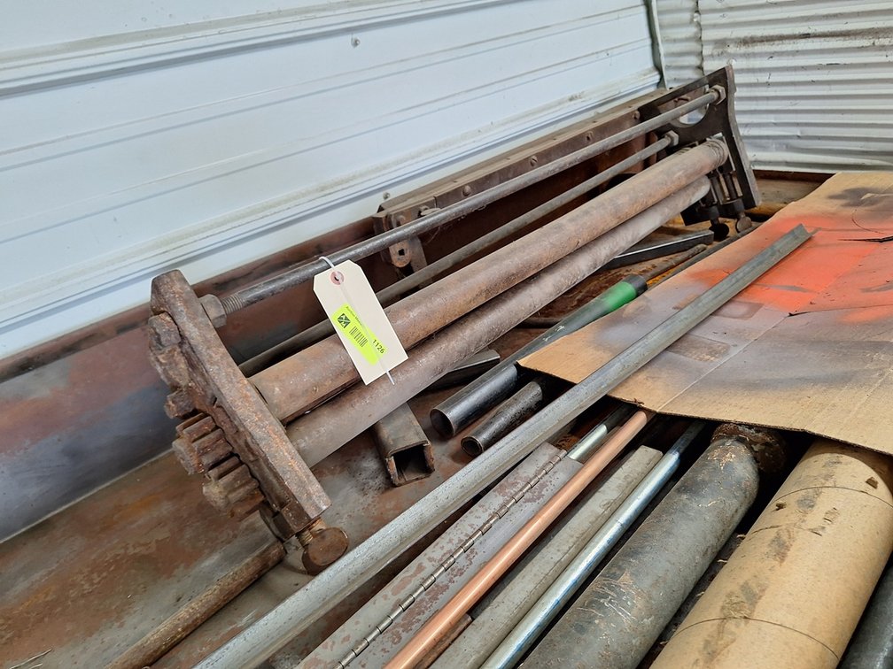 Metal Roller and Assorted Metal Parts in Back of Room