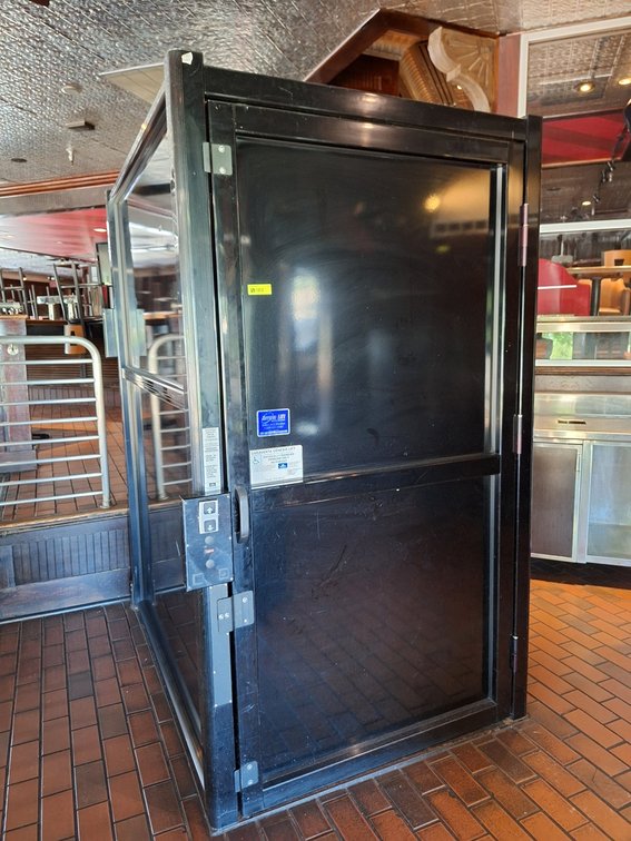 Garaventa Genesis Vertical Platform Wheelchair Lift, 750 lbs. Capacity, 240V, 60"x65"x84"